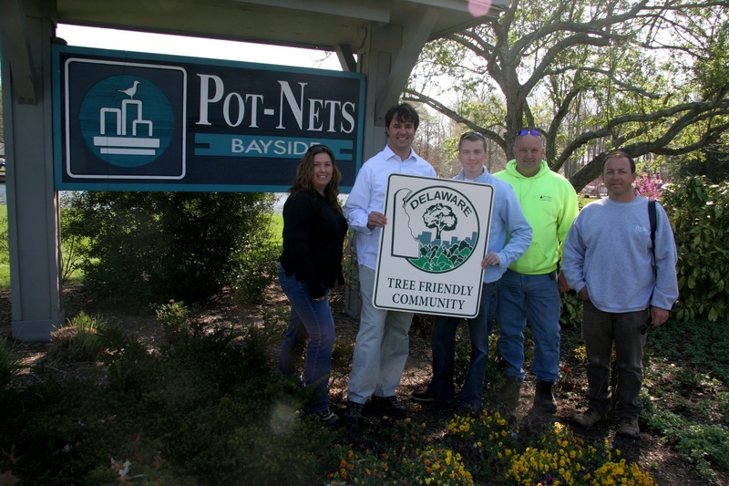 Celebrating the designation of Pot-Nets and Baywood as the newest Tree Friendly Communities in Delaware are (l-r) Delaware Forest Service's Marcia Fox, owner Robert Tunnell III, Urban Forestry Program Director Kyle Hoyd, certified arborist Jay Ashby, and landscaping director Cameron Marcelle. The award recognizes communities and homeowner groups that actively manage their urban forest resources. SOURCE SUBMITTED